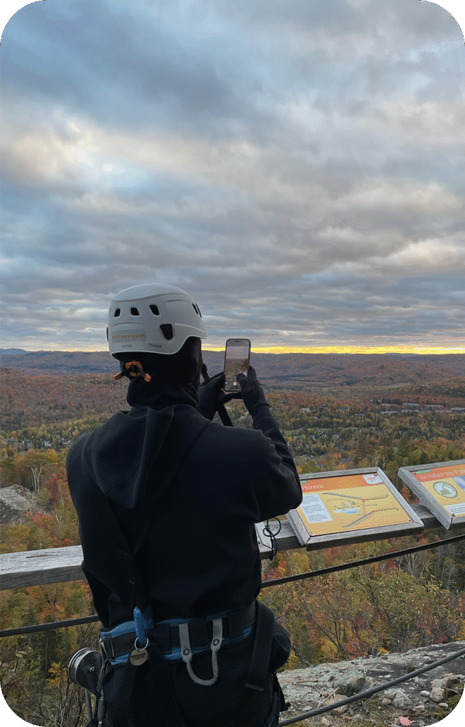 ziplining in nature taking a picture of the tarting sunset